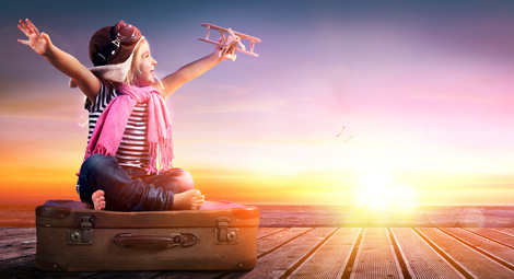 child playing with a toy plane